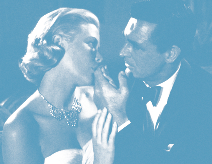 Couple in formal wear lean in as if about to kiss, close up.